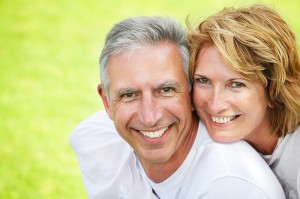 Happy mature couple smiling.